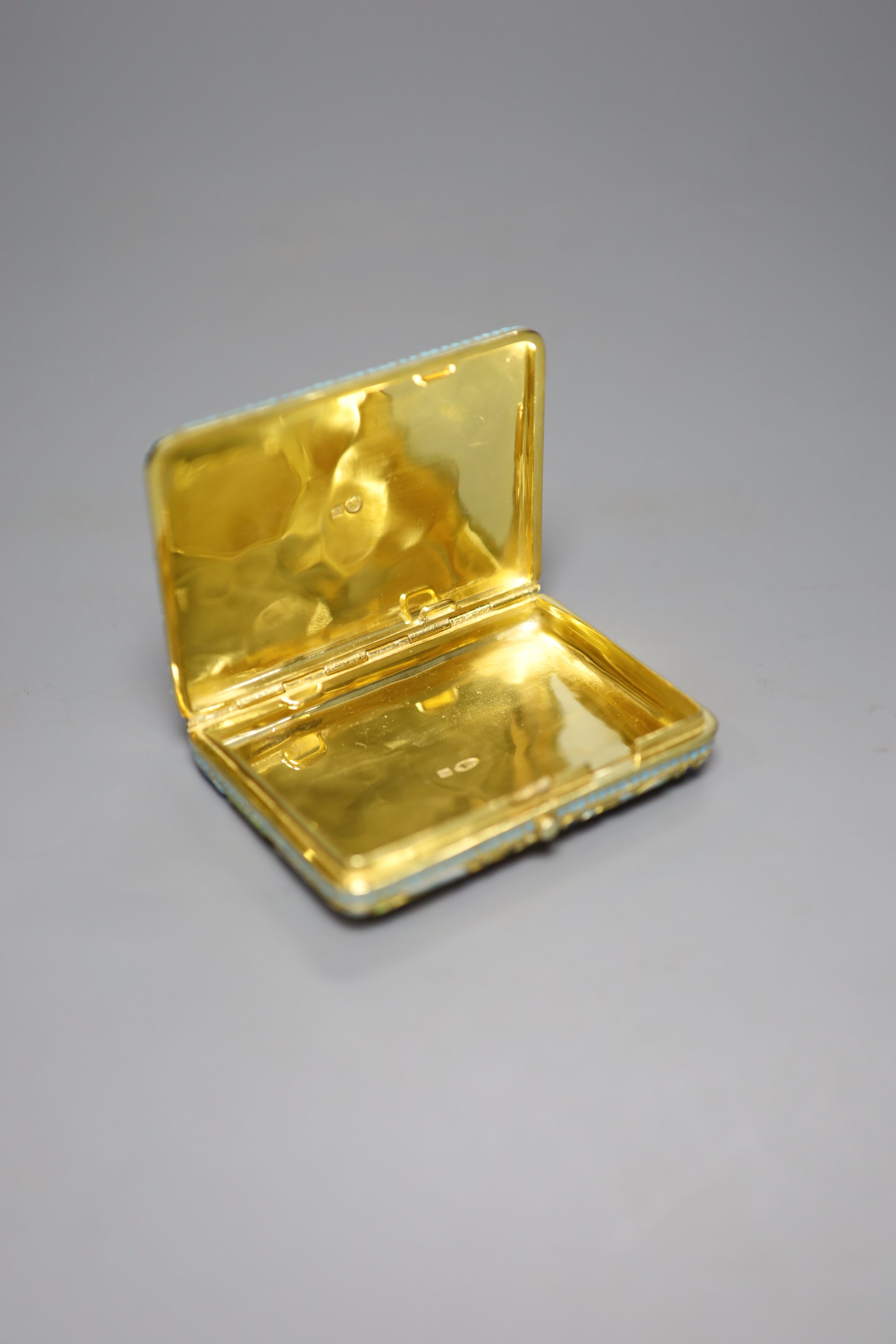 A modern Russian style gilt white metal and cloisonne enamel cigarette case, 93mm, gross 5oz.